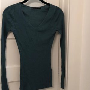 Ribbed, v-neck silk sweater.